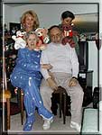 Stacie and Joy setting up the bears on Mom & Dad for another photo